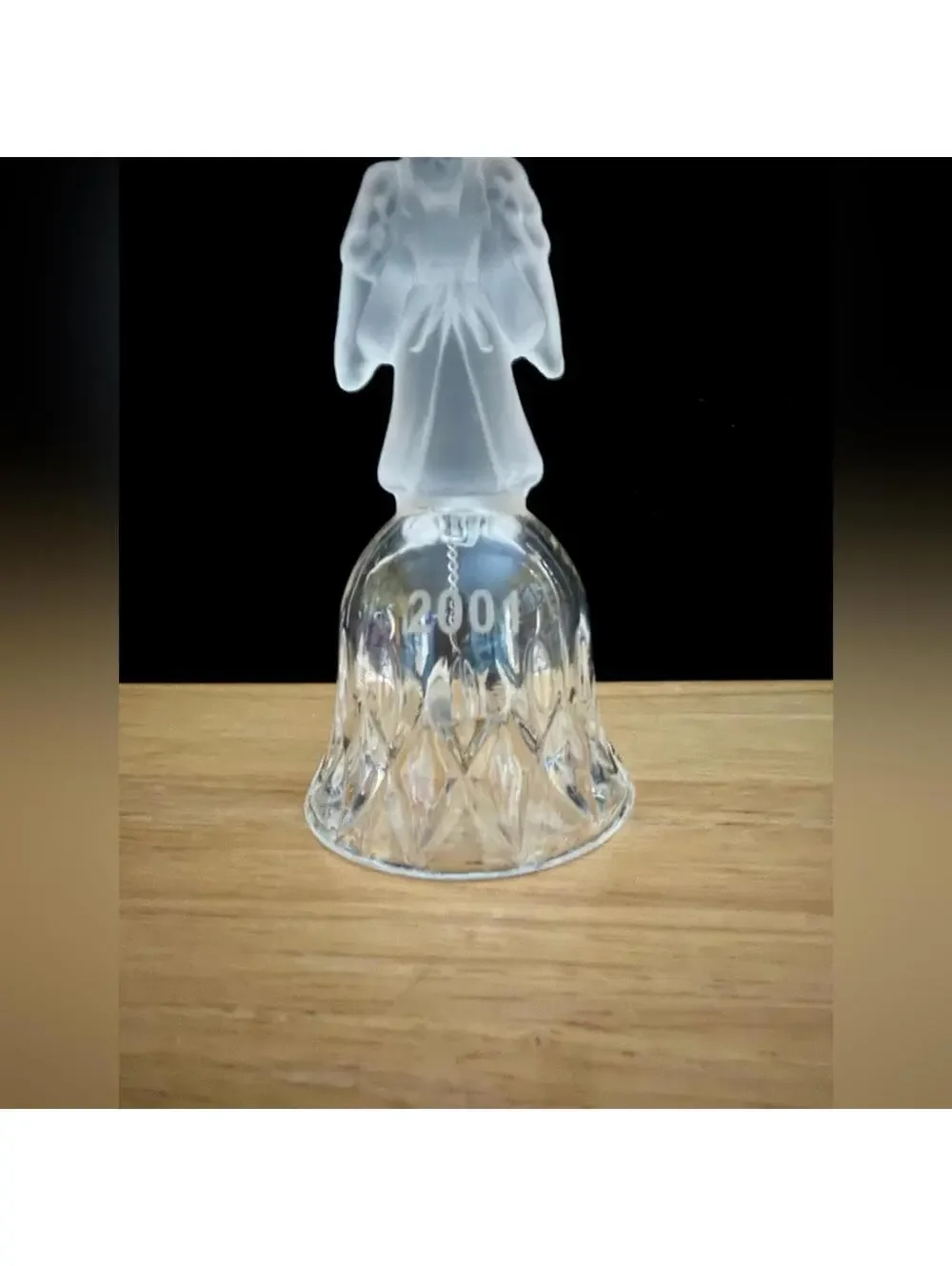 vintage frosted angel sits atop a crystal bell etched with the year 2001.